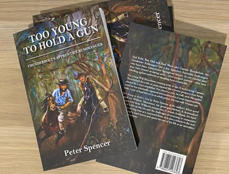 TOO YOUNG TO HOLD A GUN